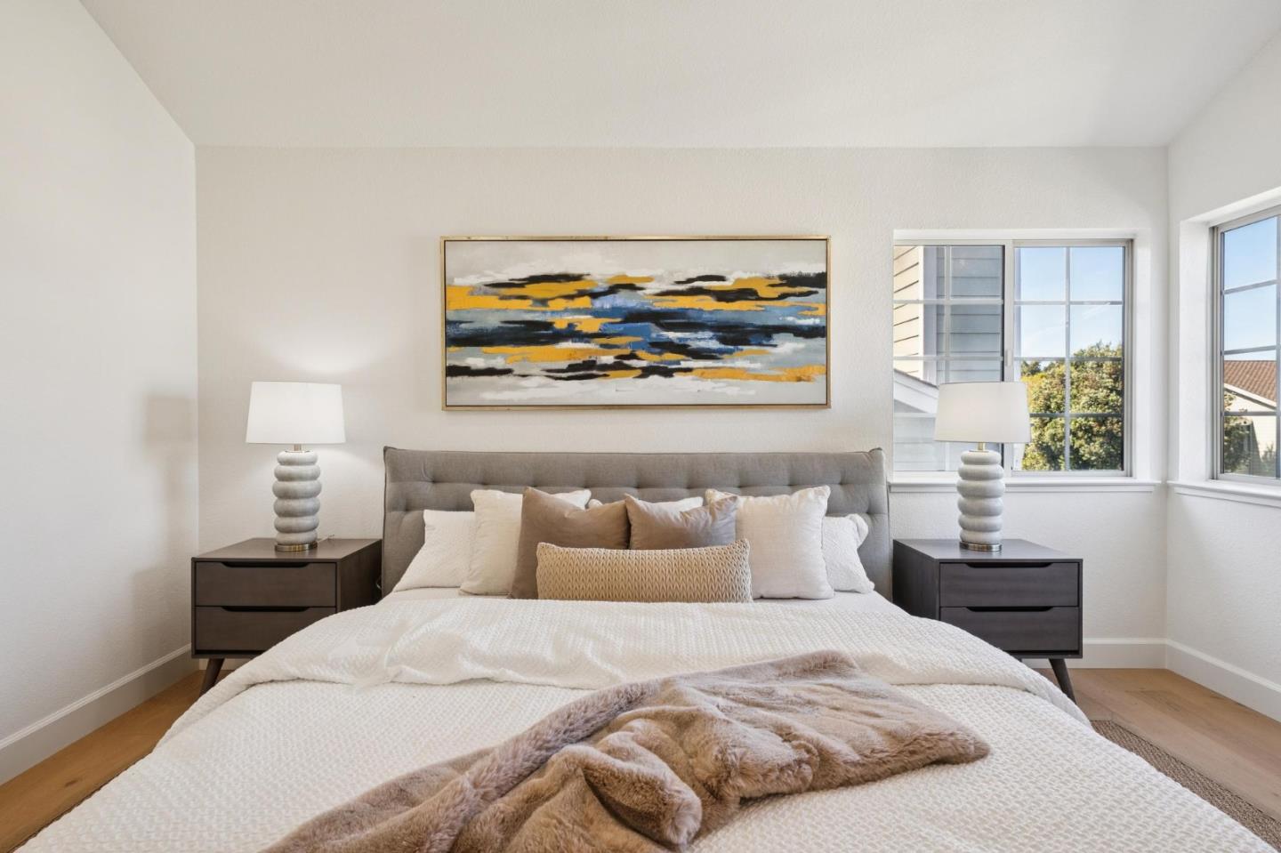 135 Troon Way Half Moon Bay, CA 94019 - Photo 20 of 44 a bedroom with a bed and a painting on the wall