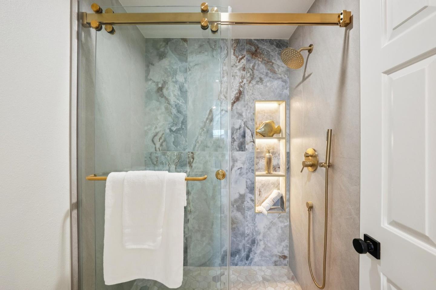 135 Troon Way Half Moon Bay, CA 94019 - Photo 24 of 44 a bathroom with a shower and a glass door