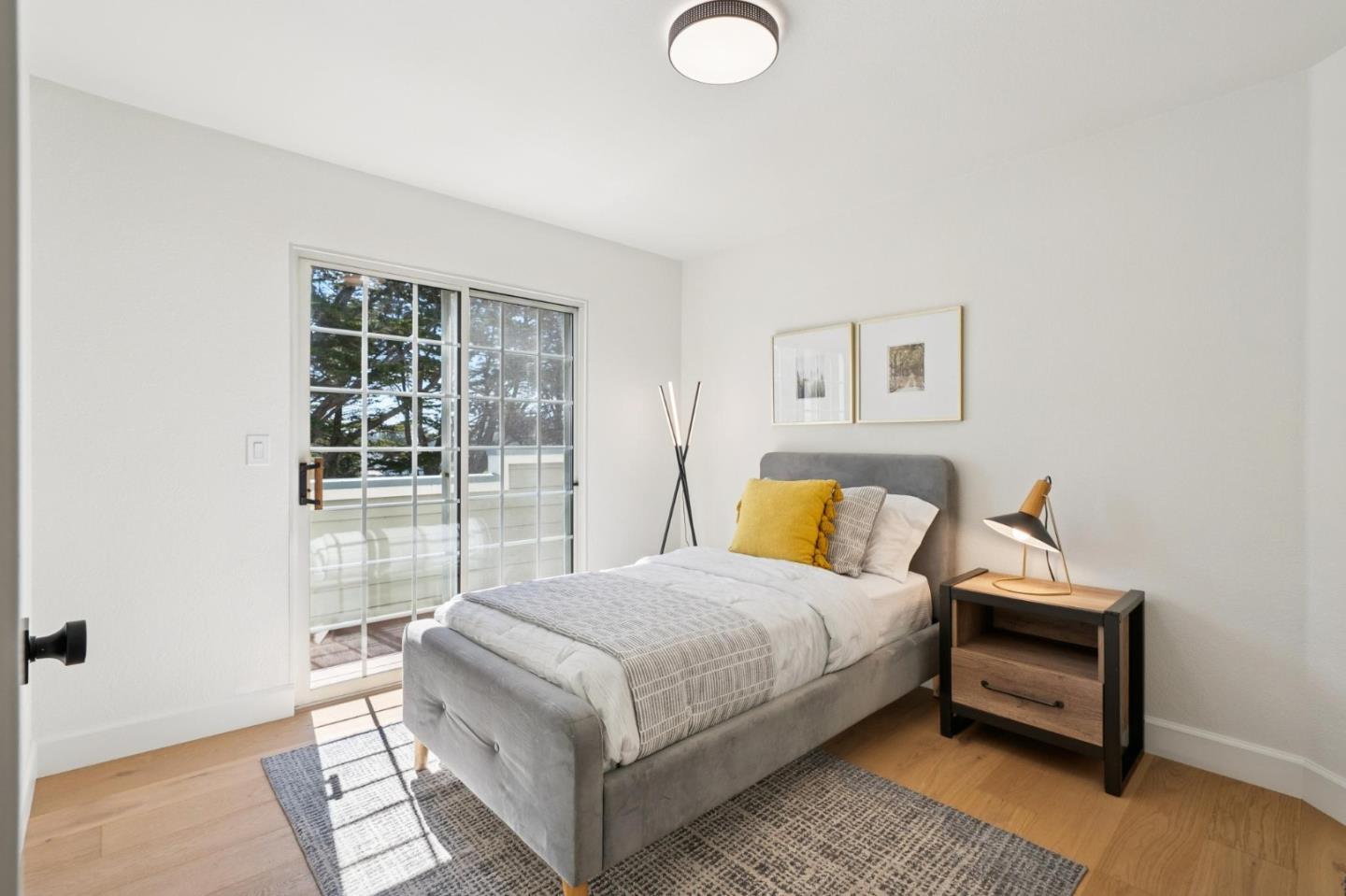 135 Troon Way Half Moon Bay, CA 94019 - Photo 27 of 44 a bedroom with a bed and a large window