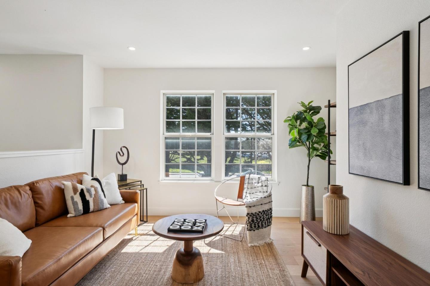 135 Troon Way Half Moon Bay, CA 94019 - Photo 35 of 44 a living room with furniture and a potted plant