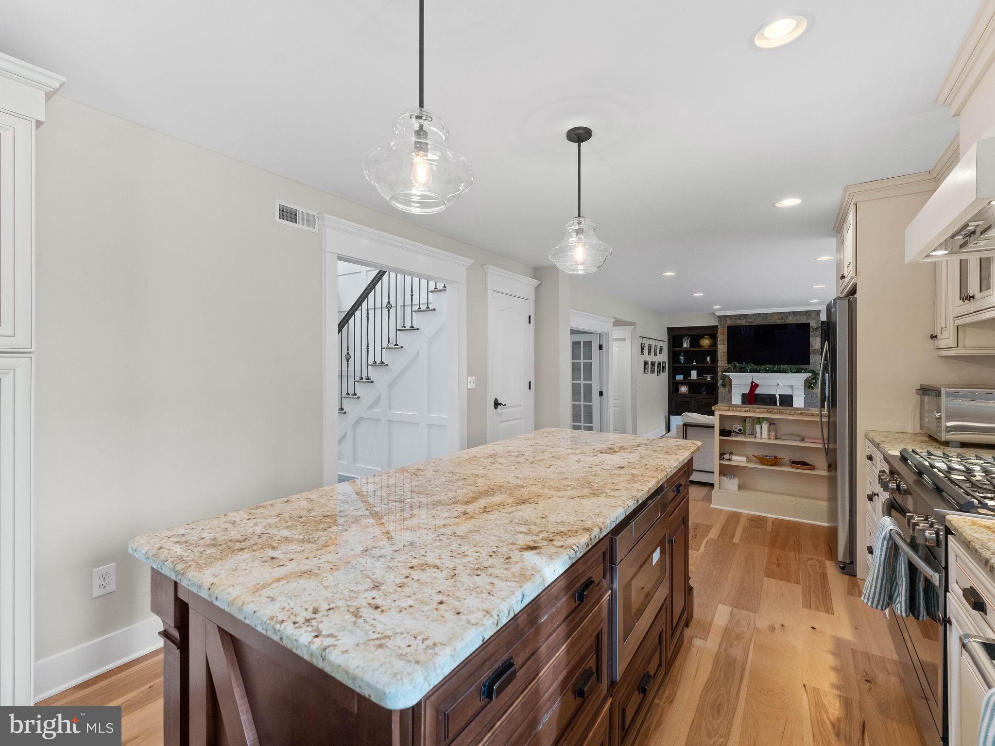 236 Carraige Hill Road Moorestown, NJ 08057 - Photo 21 of 57 a kitchen with a stove center island and chairs