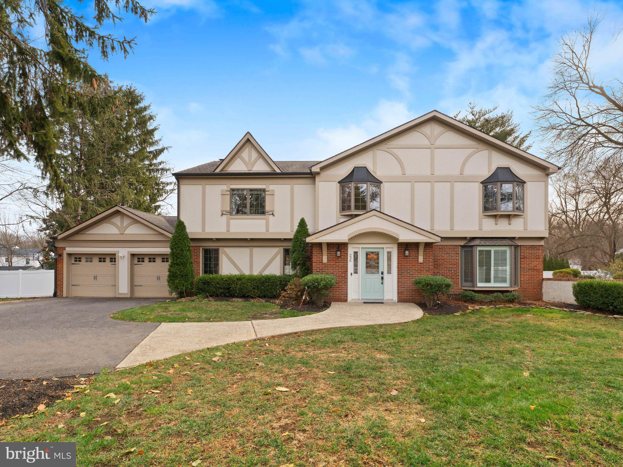 236 Carraige Hill Road Moorestown, NJ 08057 - Photo 3 of 57 a front view of a house with a yard and garage