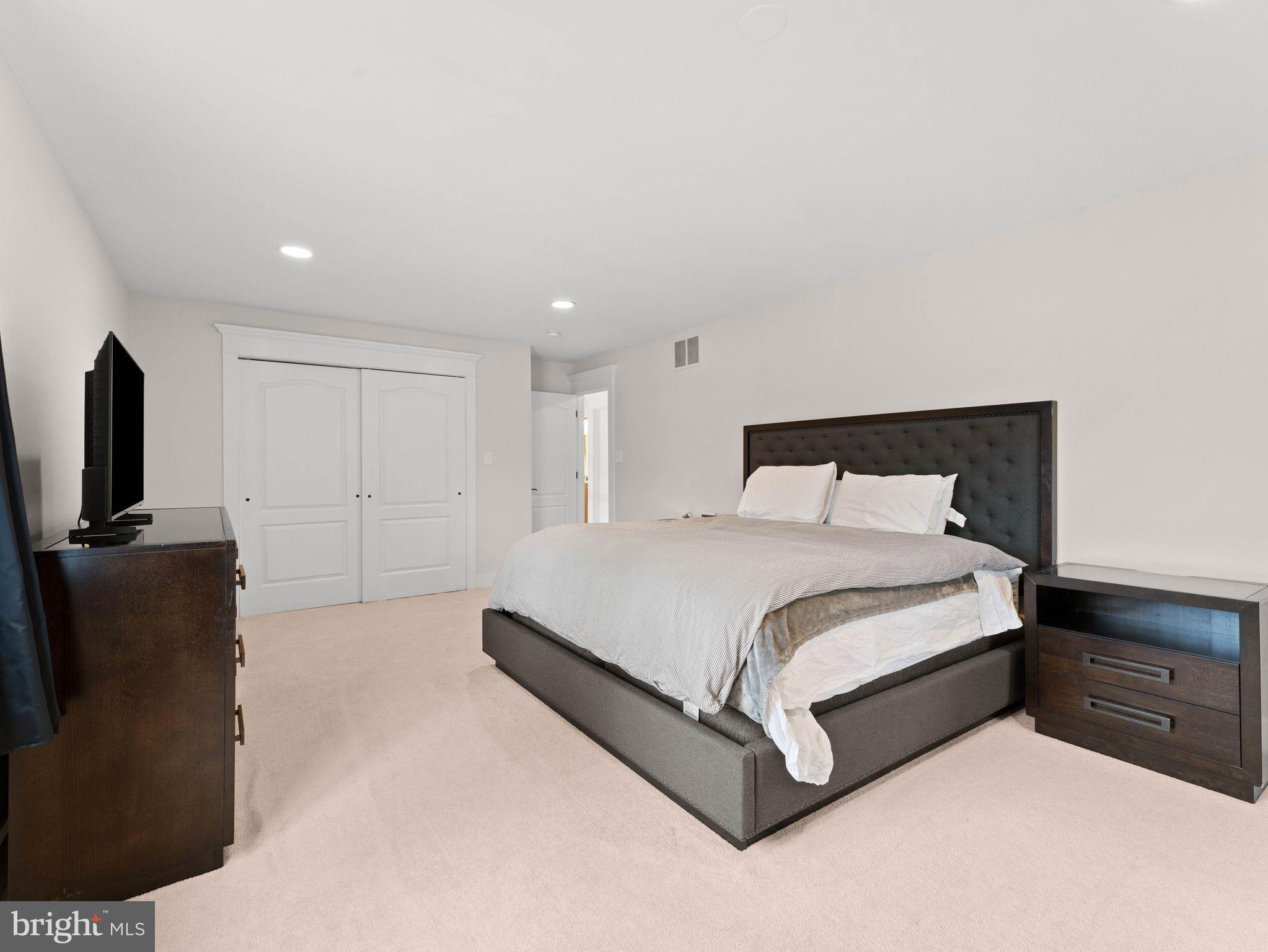 236 Carraige Hill Road Moorestown, NJ 08057 - Photo 31 of 57 a spacious bedroom with a bed and a television in it