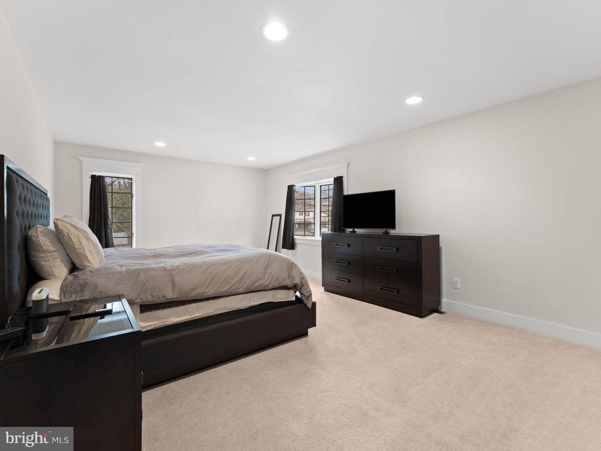 236 Carraige Hill Road Moorestown, NJ 08057 - Photo 32 of 57 a spacious bedroom with a bed and a flat screen tv