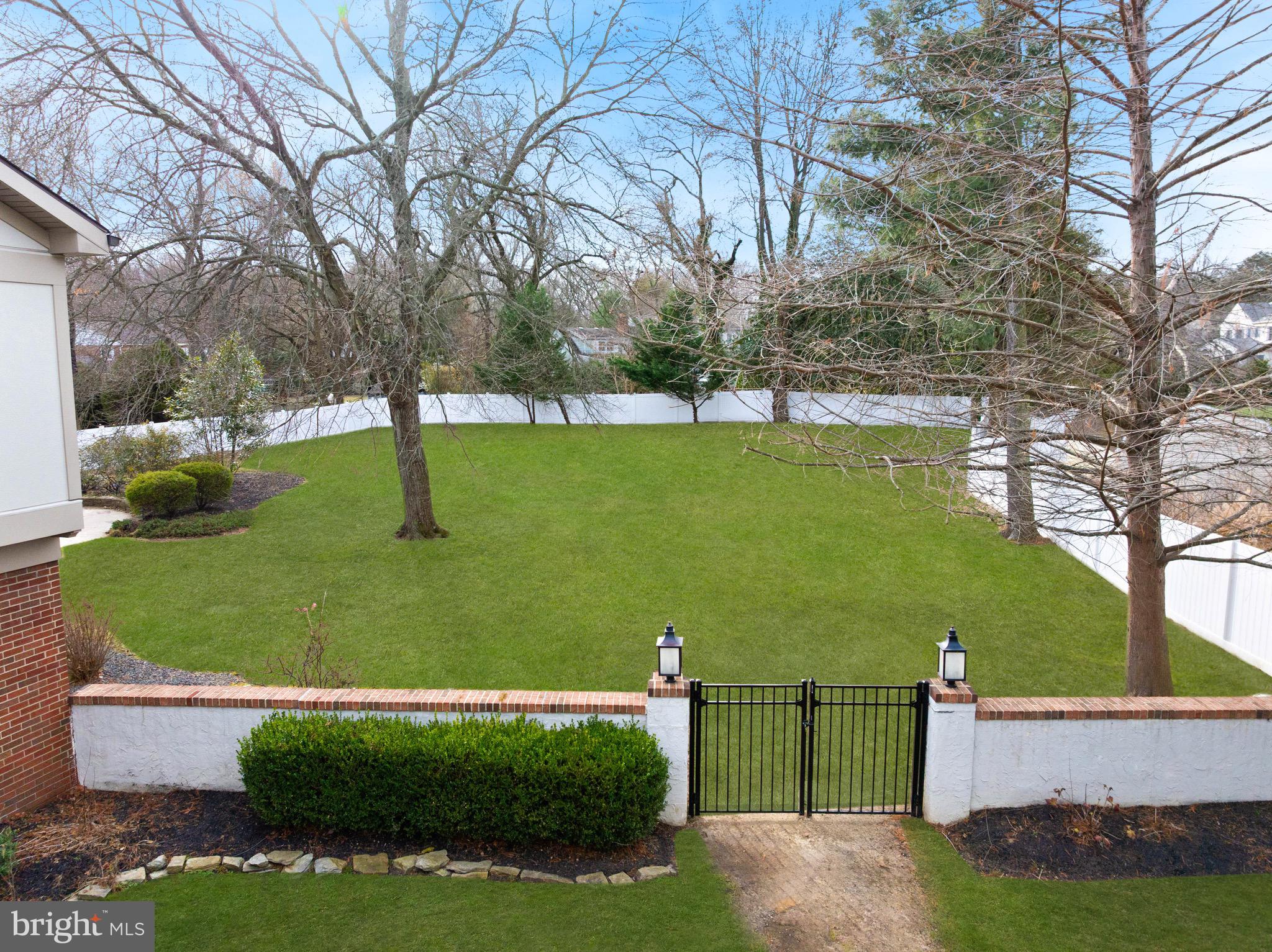 236 Carraige Hill Road Moorestown, NJ 08057 - Photo 43 of 57 a view of a garden with a house
