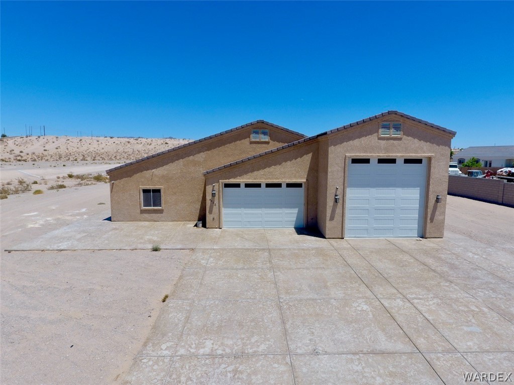 a front view of a house with a garage
