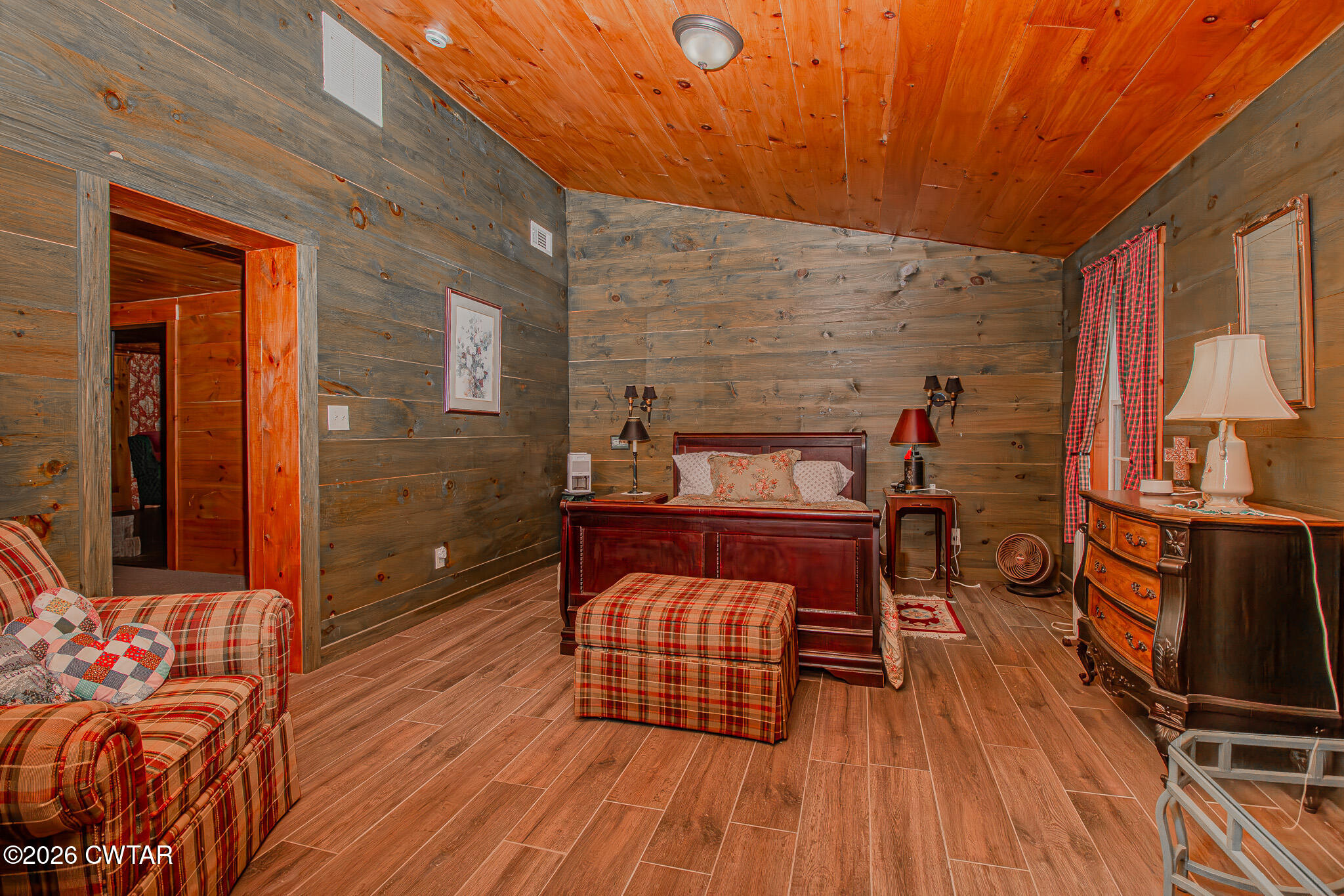 445 Wesley Lake Road Brownsville, TN 38012 - Photo 10 of 21 a bedroom with a bed and wooden floor