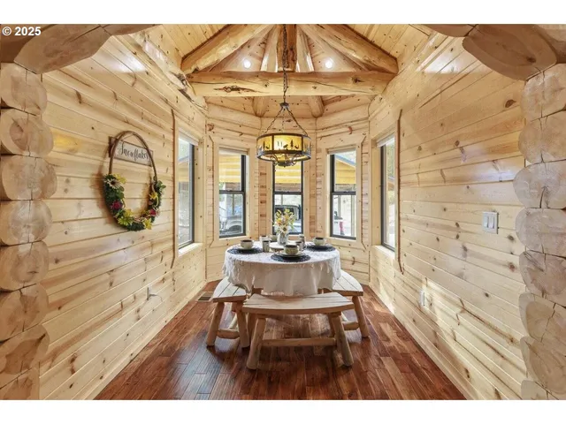 a kitchen with stainless steel appliances kitchen island granite countertop a refrigerator and cabinets