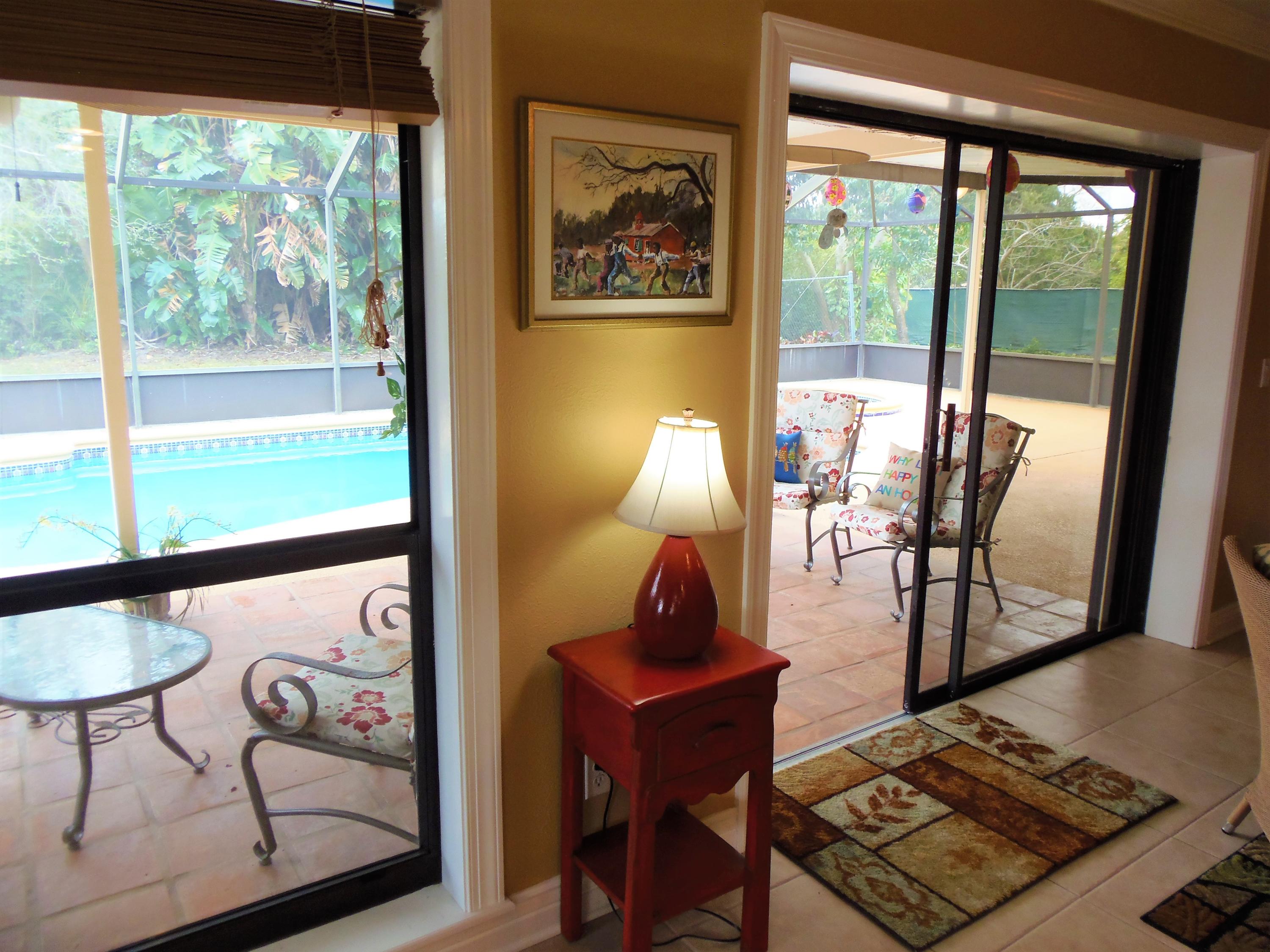 2062 Southeast Elmhurst Road Port St. Lucie, FL 34952 - Photo 15 of 46 Family Room looking at pool
