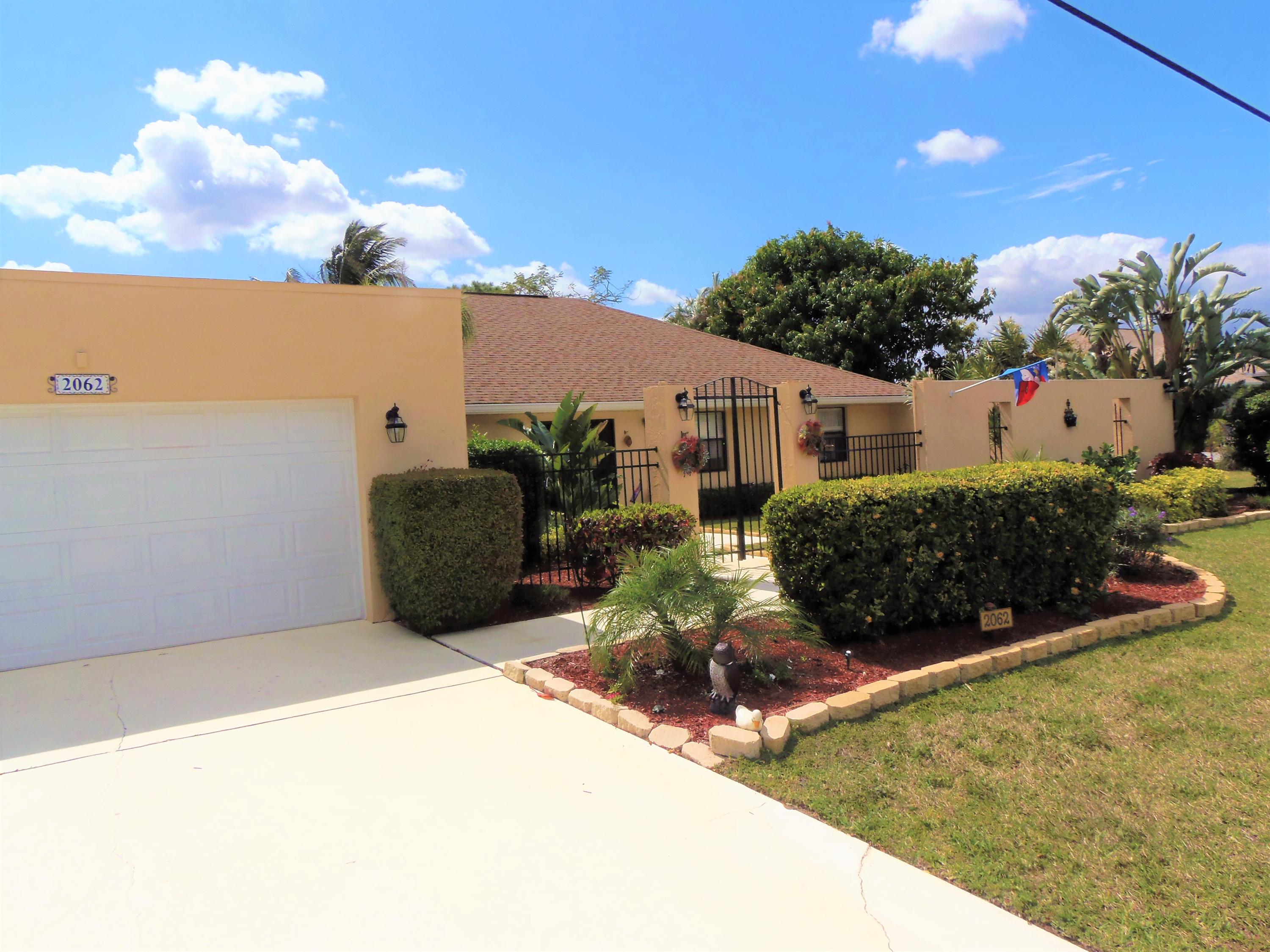 2062 Southeast Elmhurst Road Port St. Lucie, FL 34952 - Photo 2 of 46 Front 5