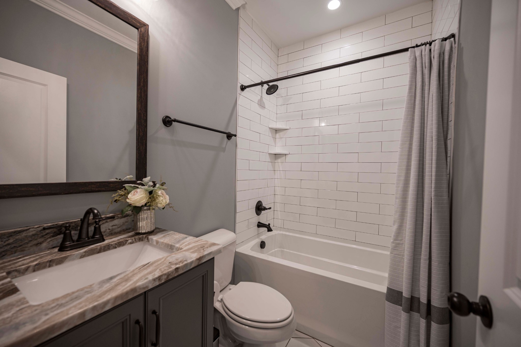 128 Seclusion Court Murfreesboro, TN 37129 - Photo 26 of 68 a bathroom with a granite countertop sink toilet and shower