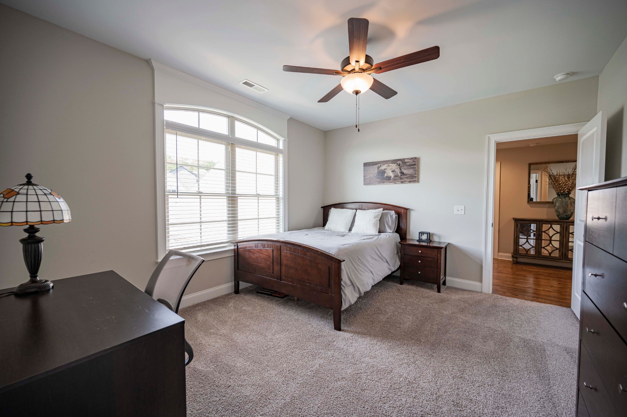 128 Seclusion Court Murfreesboro, TN 37129 - Photo 30 of 68 a spacious bedroom with a bed a dresser and a large window