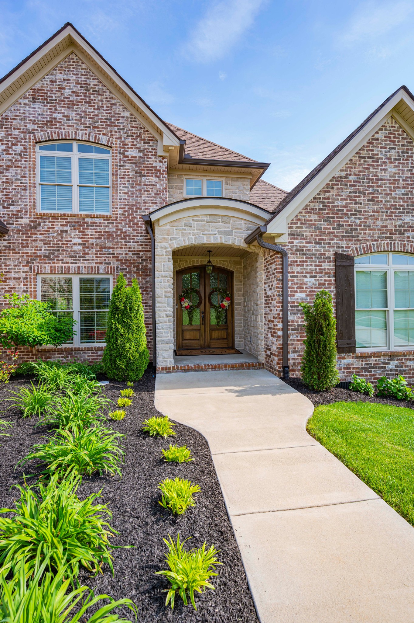 128 Seclusion Court Murfreesboro, TN 37129 - Photo 3 of 68 a front view of a house with a garden