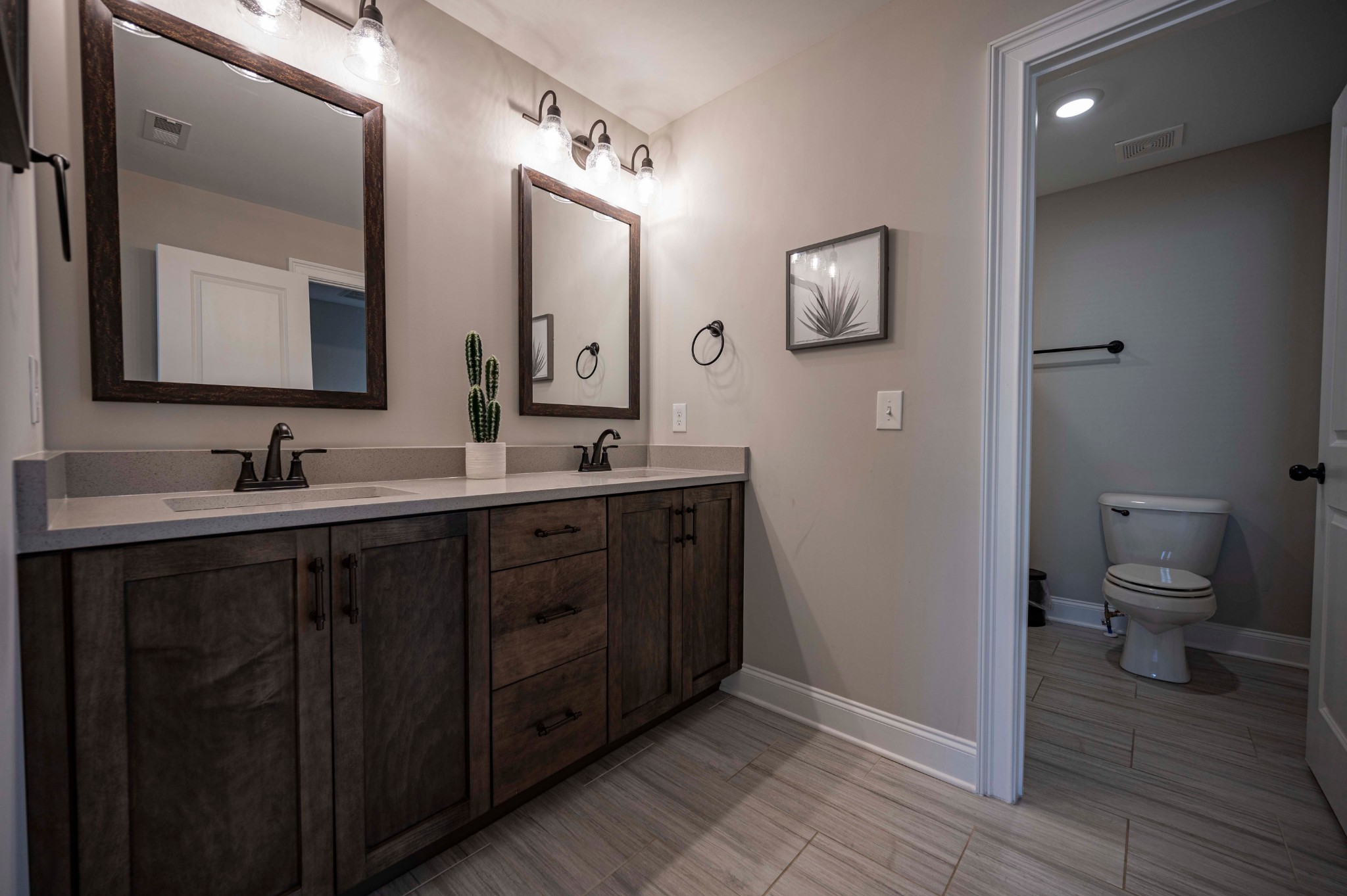 128 Seclusion Court Murfreesboro, TN 37129 - Photo 34 of 68 a bathroom with a double vanity sink and a toilet