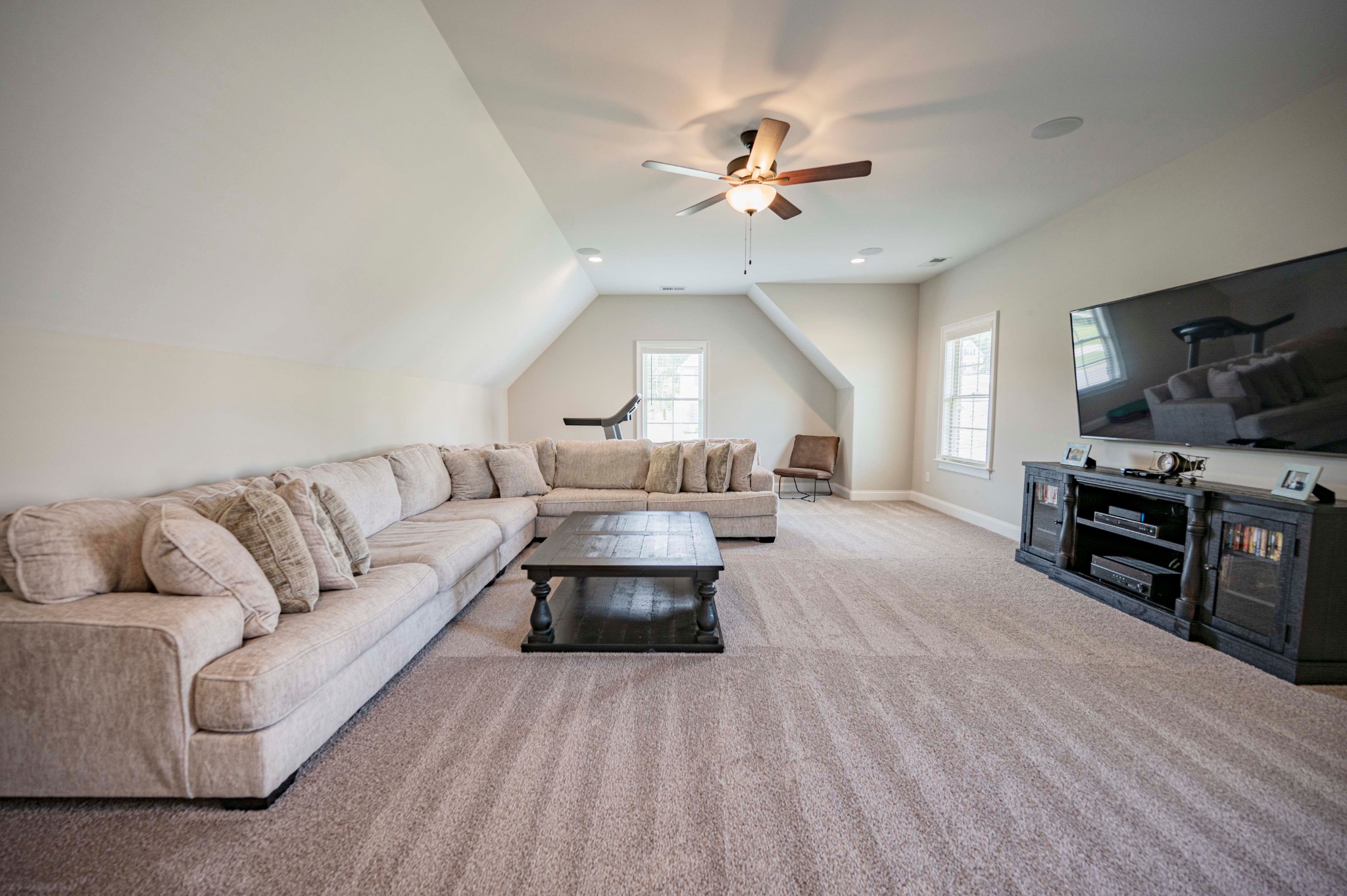 128 Seclusion Court Murfreesboro, TN 37129 - Photo 39 of 68 a living room with furniture and a flat screen tv