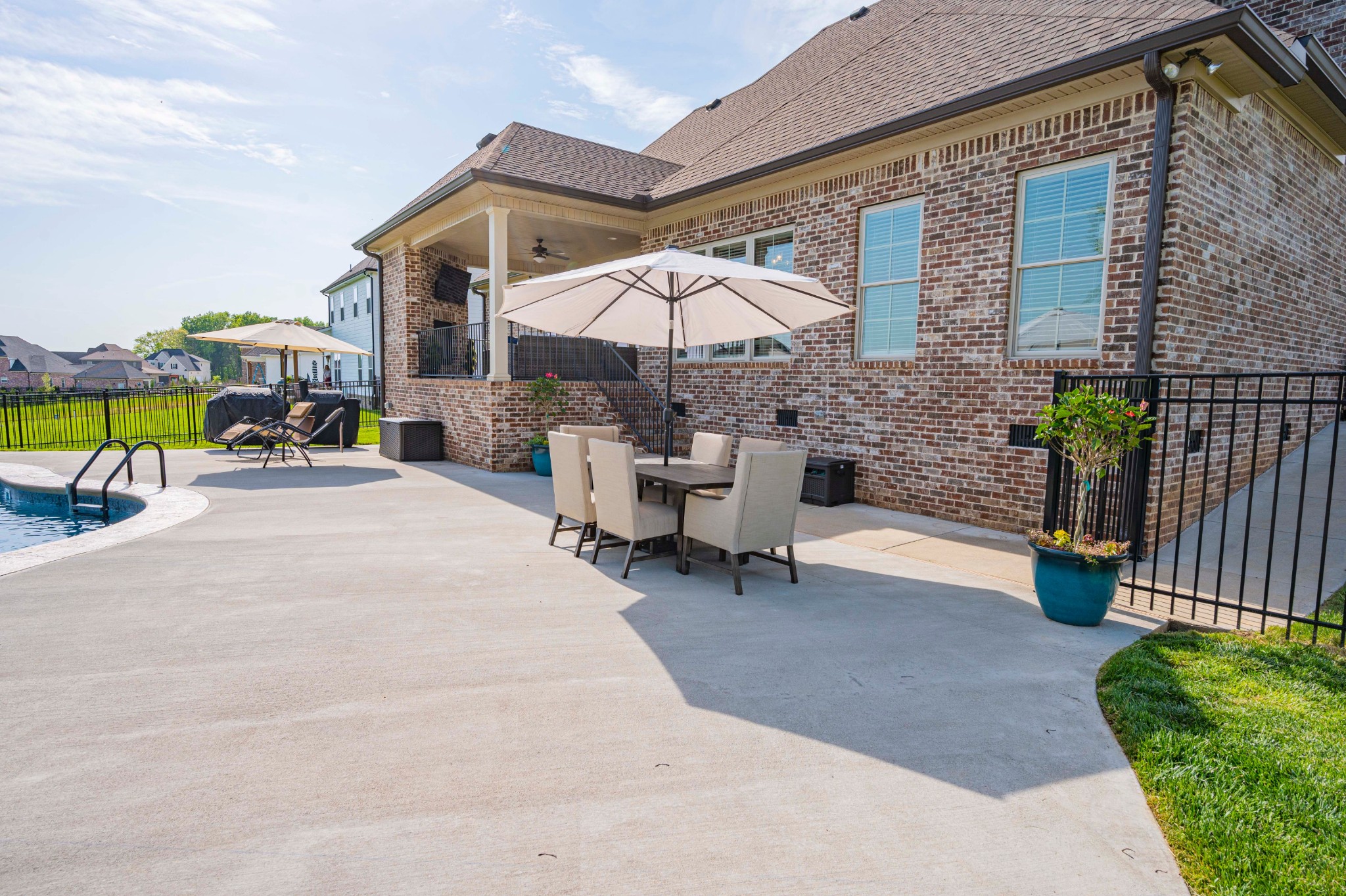128 Seclusion Court Murfreesboro, TN 37129 - Photo 59 of 68 a view of a patio with a table and chairs under an umbrella