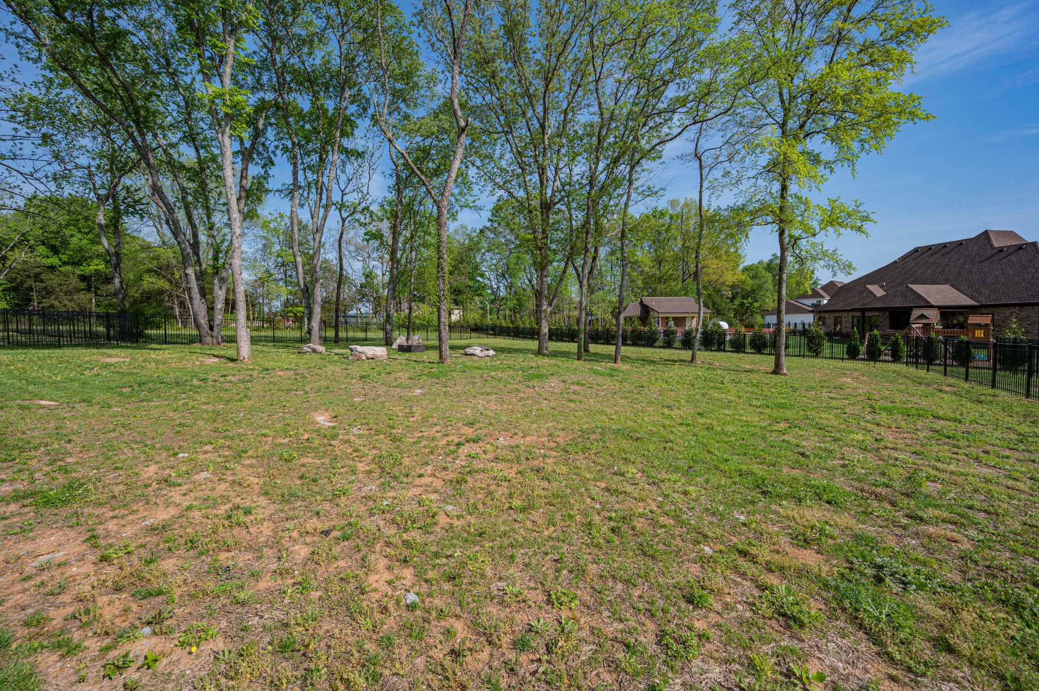 128 Seclusion Court Murfreesboro, TN 37129 - Photo 60 of 68 a backyard of a house with lots of green space and fountain