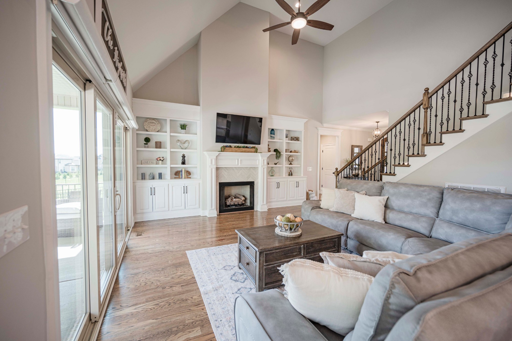 128 Seclusion Court Murfreesboro, TN 37129 - Photo 9 of 68 a living room with furniture a fireplace and a flat screen tv