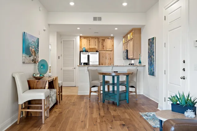 a view of a dining room with furniture and wooden floor