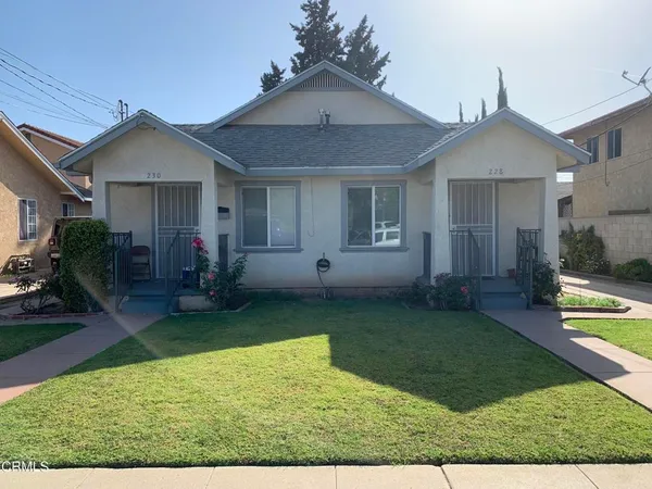 a view of a house with backyard porch and furniture