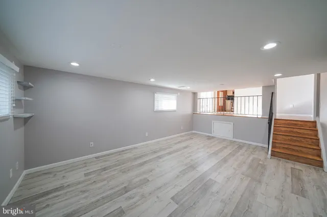 a view of a kitchen with a sink and a refrigerator