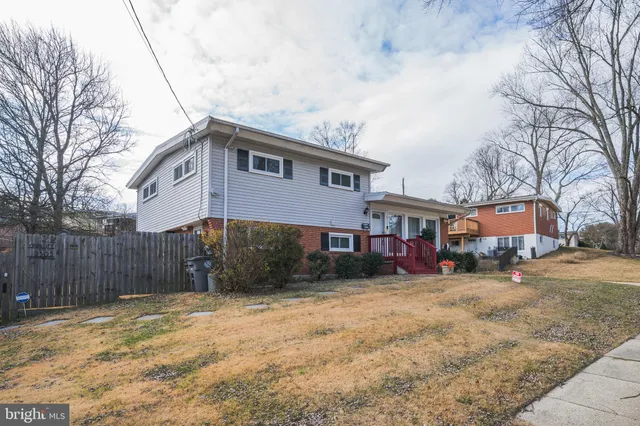 a house that has a tree in front of it