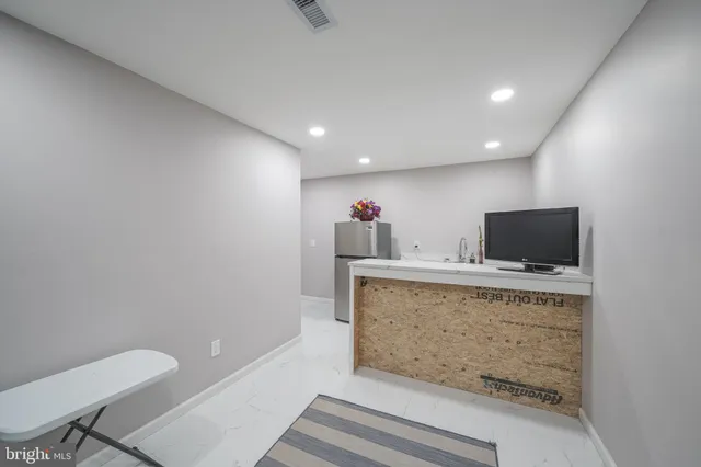 a view of livingroom with furniture and white walls