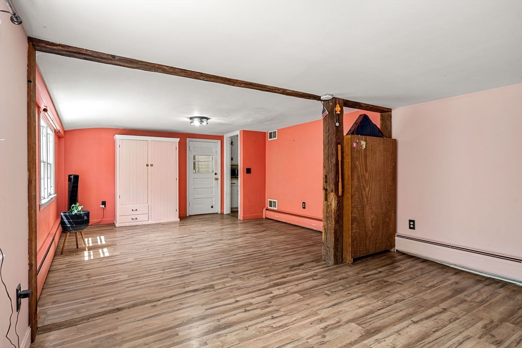 600 Main Street Ashby, MA 01431 - Photo 18 of 40 a view of a room with wooden floor and a window