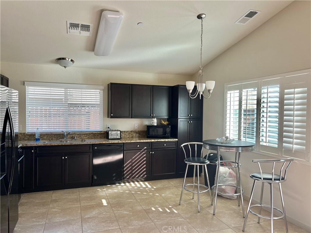 2185 Drake Avenue Merced, CA 95348 - Photo 11 of 34 a kitchen with a sink and cabinets