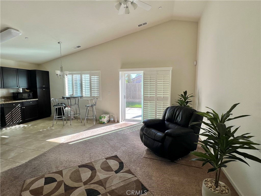 2185 Drake Avenue Merced, CA 95348 - Photo 13 of 34 a living room with furniture and a flat screen tv