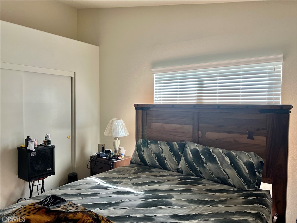 2185 Drake Avenue Merced, CA 95348 - Photo 19 of 34 a bedroom with a bed and a window