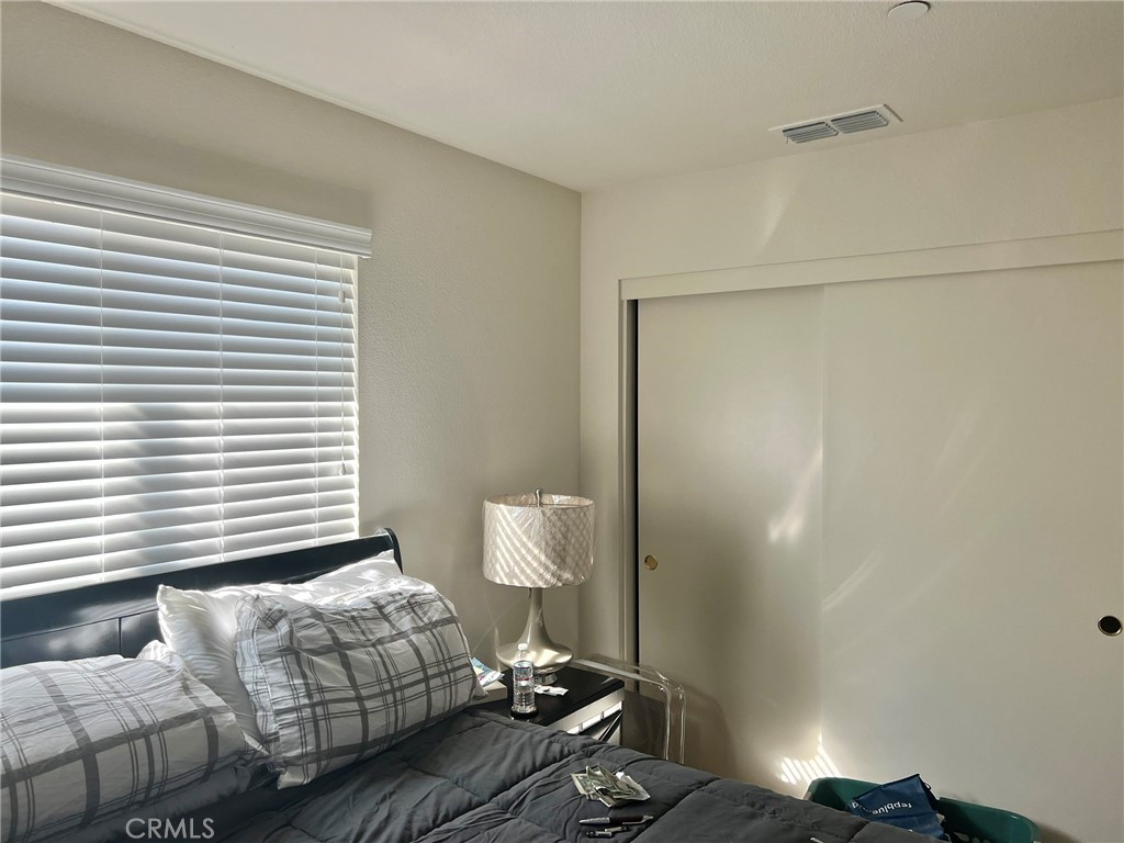 2185 Drake Avenue Merced, CA 95348 - Photo 20 of 34 a bedroom with a bed and a window