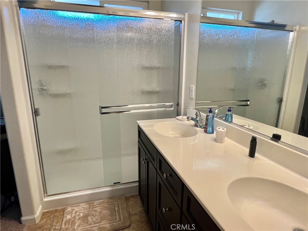 2185 Drake Avenue Merced, CA 95348 - Photo 22 of 34 a bathroom with a sink and a mirror