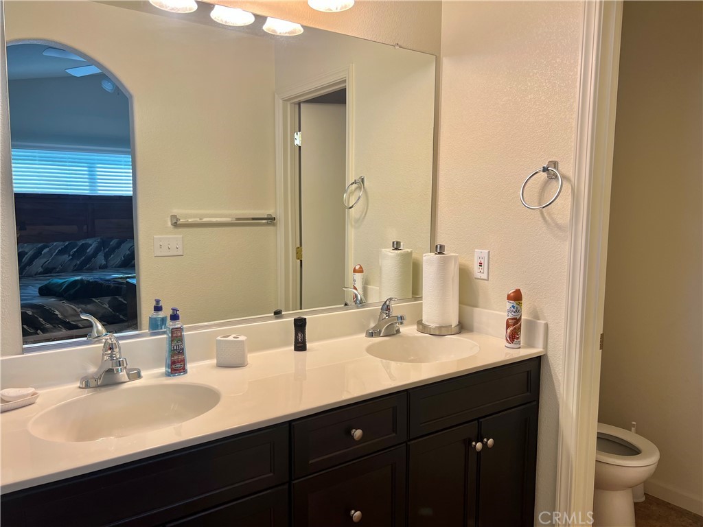 2185 Drake Avenue Merced, CA 95348 - Photo 23 of 34 a bathroom with a double vanity sink and a mirror