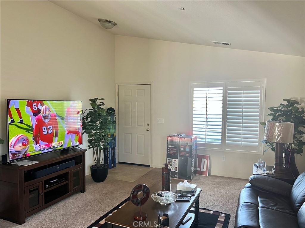 2185 Drake Avenue Merced, CA 95348 - Photo 6 of 34 a living room with furniture a flat screen tv and a window