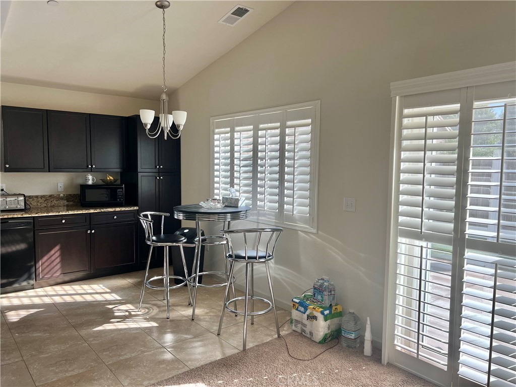 2185 Drake Avenue Merced, CA 95348 - Photo 10 of 34 a view of a workspace with furniture and a window