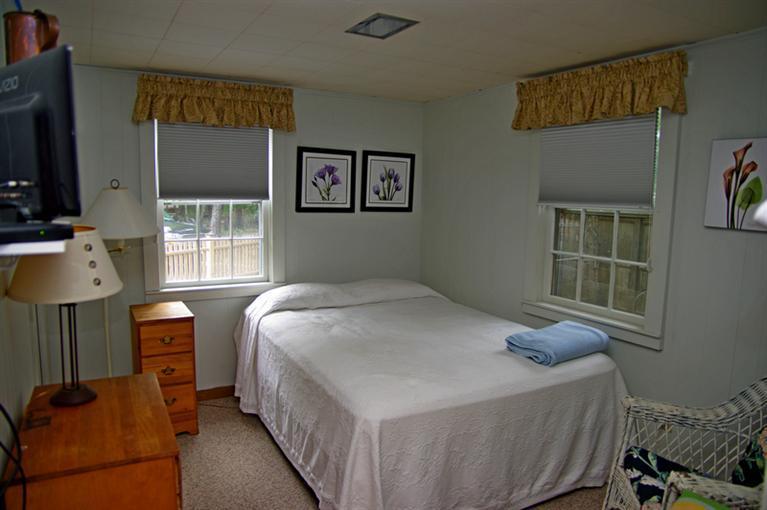 169 Foster Road Brewster, MA 02631 - Photo 13 of 14 a bedroom with a bed and a window
