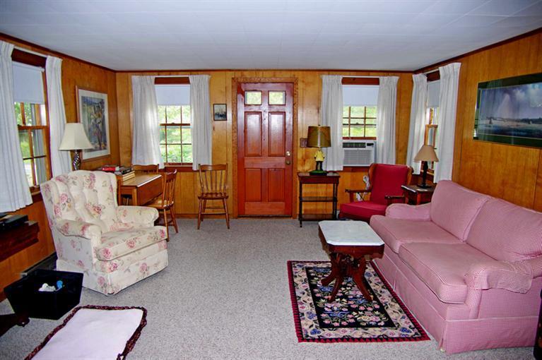 169 Foster Road Brewster, MA 02631 - Photo 6 of 14 a living room with furniture and a flat screen tv