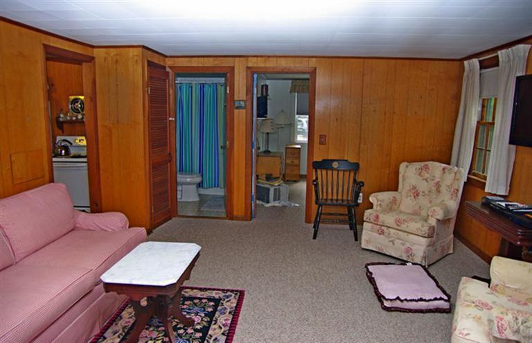 169 Foster Road Brewster, MA 02631 - Photo 7 of 14 a living room with furniture and wooden floor