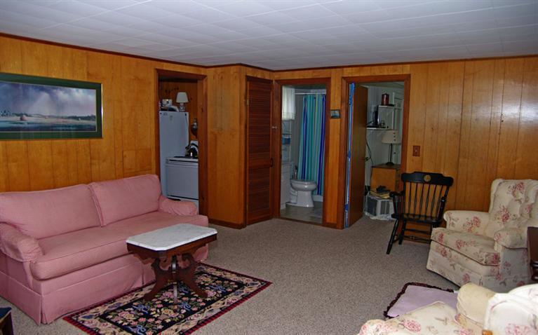 169 Foster Road Brewster, MA 02631 - Photo 8 of 14 a living room with furniture a rug and a table