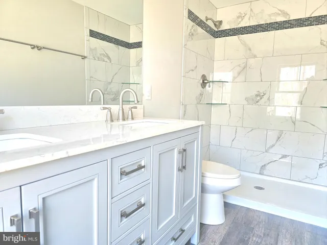 a bathroom with a sink and a shower