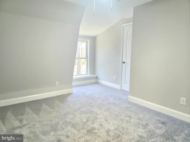 a bathroom with a bathtub shower sink vanity and toilet