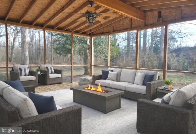 a living room with furniture and a patio