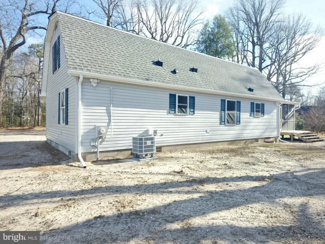 a view of a house with snow on the road