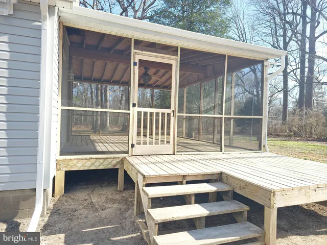 a view of a balcony with a table and chair