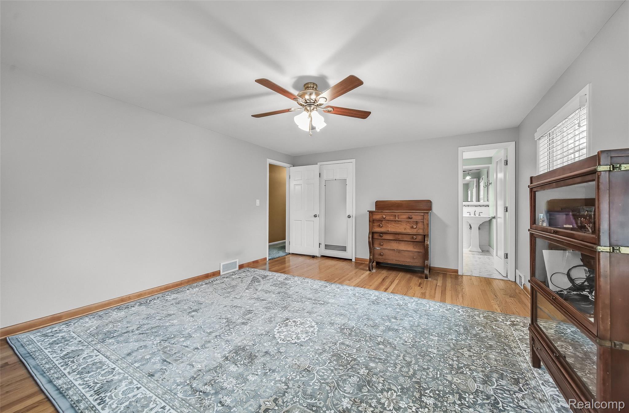 100 Overhill Road Bloomfield Hills, MI 48301 - Photo 28 of 55 Bedroom with light wood finished floors and ceiling fan