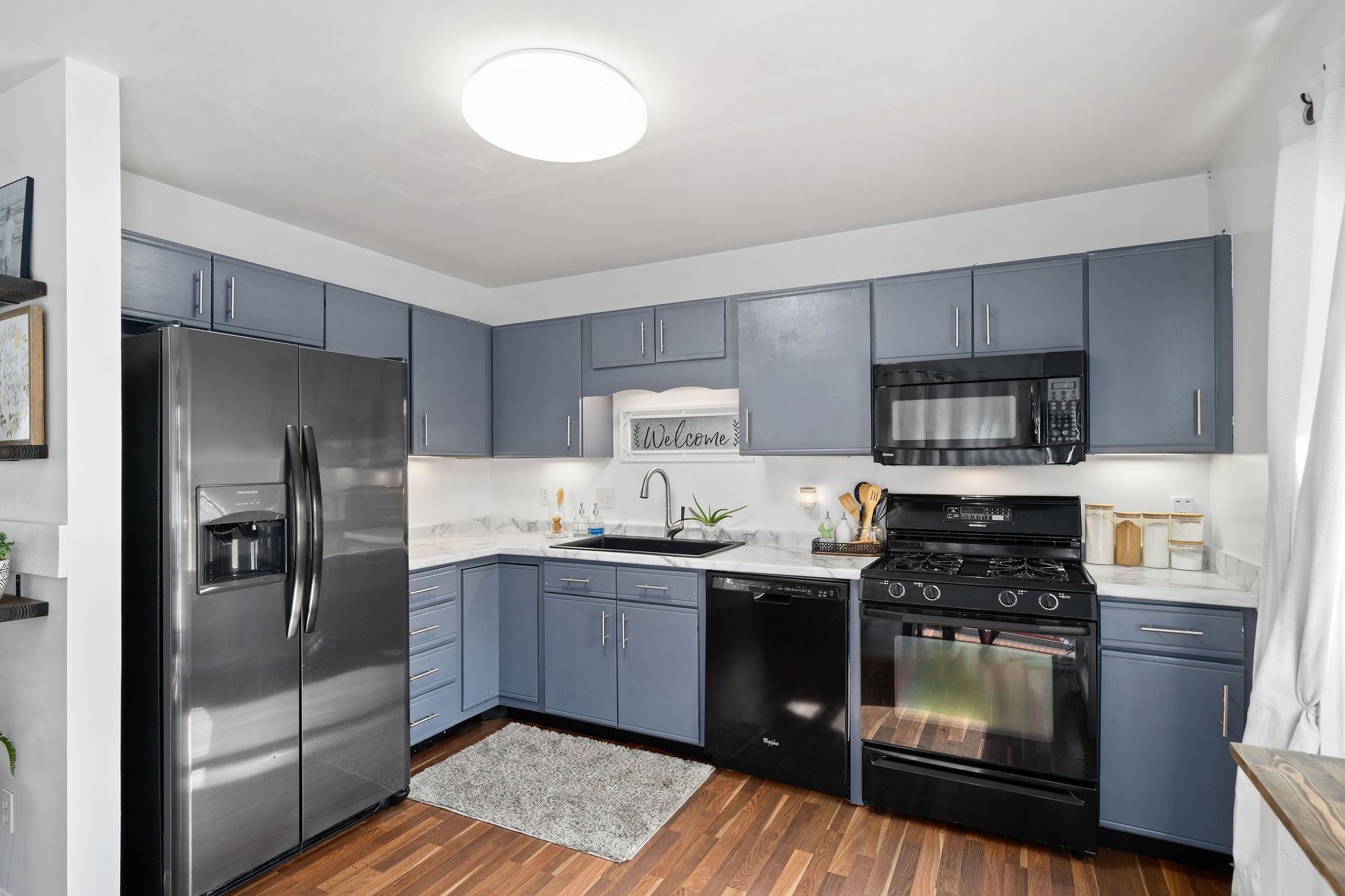 6041 Ebenezer Road Greenbrier, TN 37073 - Photo 9 of 29 a kitchen with stainless steel appliances granite countertop a stove a sink and a refrigerator