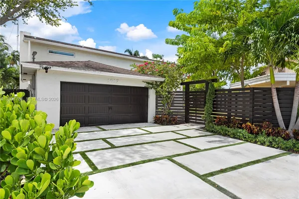 a front view of a house with a garage