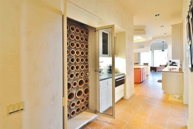 a dining room with furniture a chandelier and wooden floor