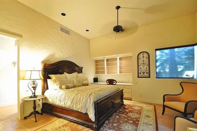 a view of swimming pool with outdoor seating and plants